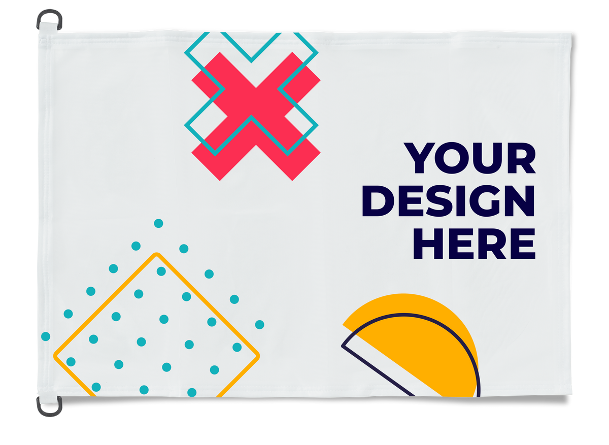 A white customizable flag or banner with a metal grommet on the left side. The banner features placeholder graphics and the text 'YOUR DESIGN HERE' in navy blue, with sample geometric shapes in pink, yellow, and teal.