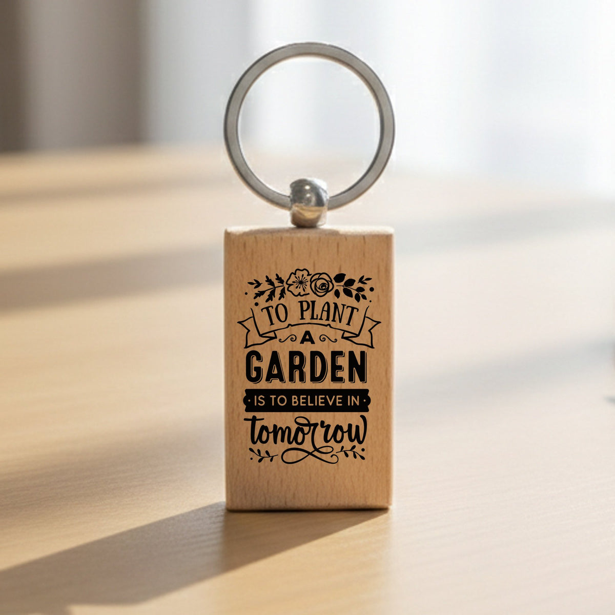 To Plant a Garden Is to Believe in Tomorrow wooden keyring in standard