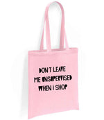 DON'T LEAVE ME UNSUPERVISED WHEN I SHOP tote bag in light pink