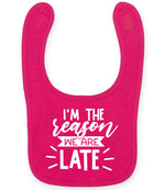 I'M THE Reason WE ARE LATE toddler bib in fuchsia