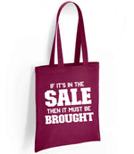 If It's in the Sale Then It Must Be Brought tote bag in burgundy