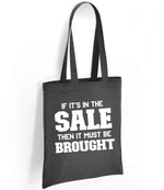 If It's in the Sale Then It Must Be Brought tote bag in charcoal
