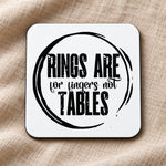 RINGS ARE for Fingers Not TABLES coaster in white