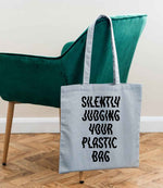 Silently Judging Your Plastic Bag tote bag in light blue