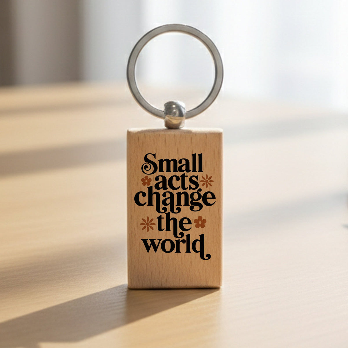 Small Acts Change the World. wooden keyring in standard