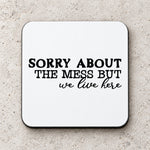SORRY ABOUT THE MESS BUT We Live Here coaster in white