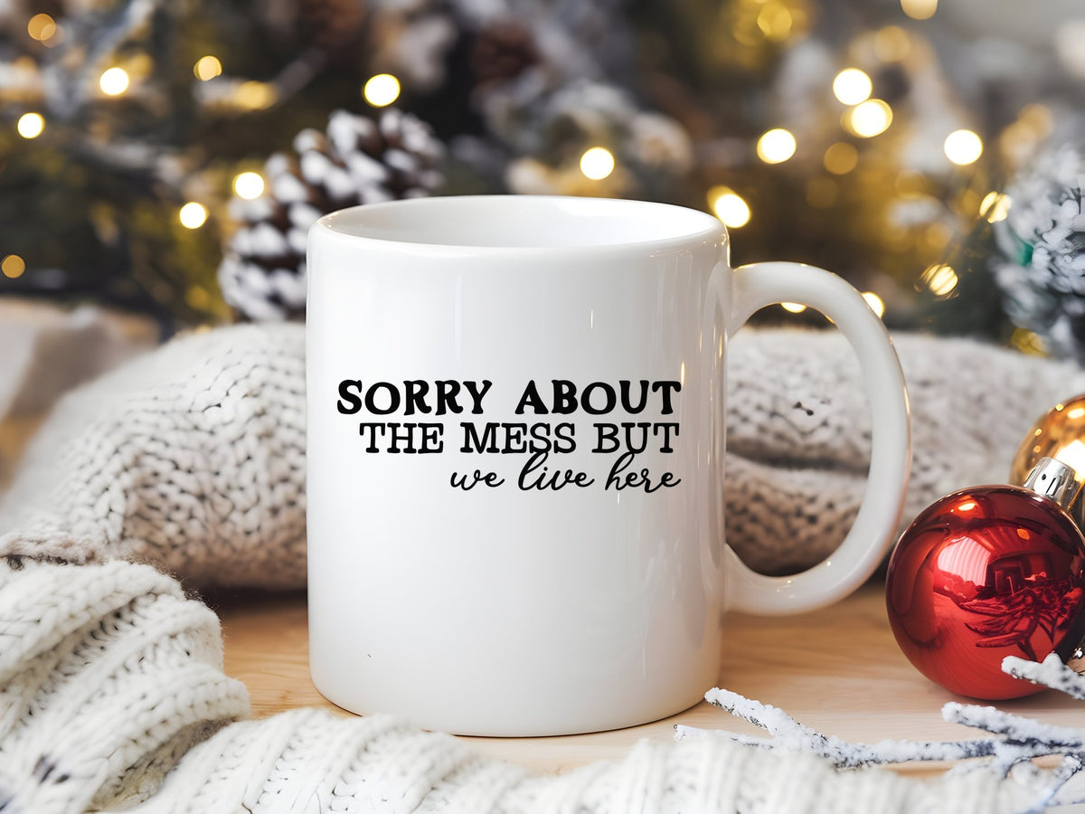 SORRY ABOUT THE MESS BUT We Live Here standard mug in white