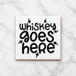Whiskey Goes Here ceramic coaster in white