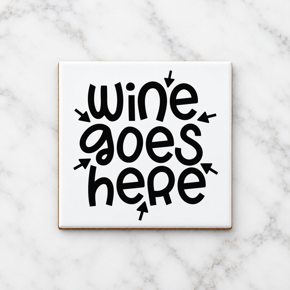 Wine Goes Here ceramic coaster in white
