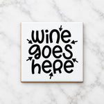 Wine Goes Here ceramic coaster in white