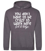 You Don't Have to Be Crazy to Work Here but It Helps! hoodie in steel grey